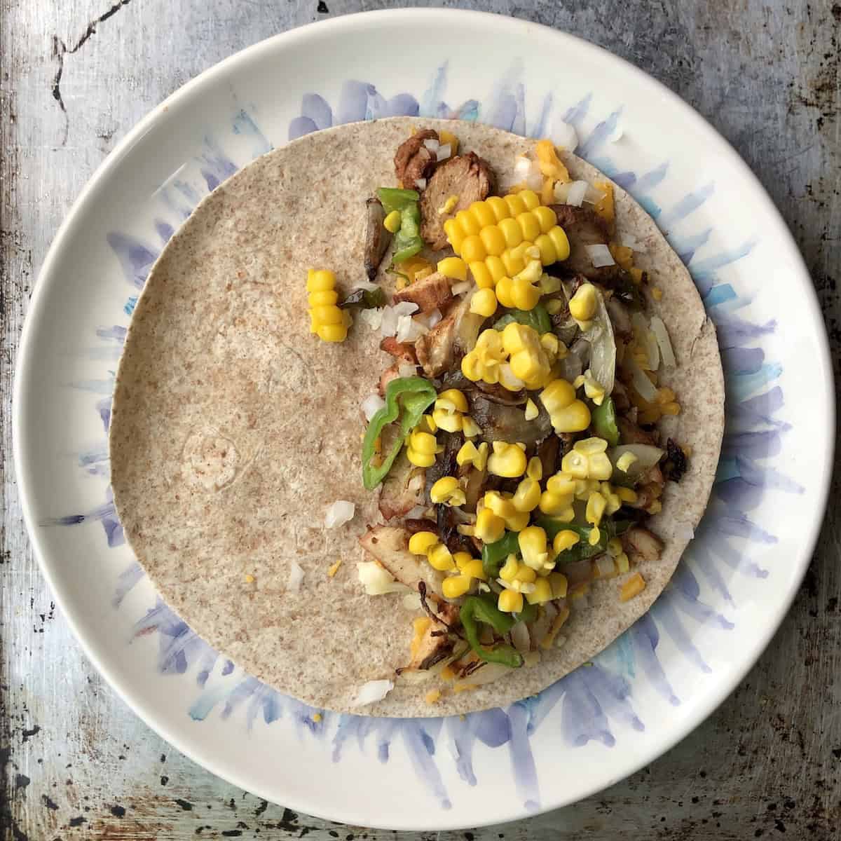 Cooked sweet corn cut off the cob added to the chicken quesadilla filling for creative quesadilla ideas.
