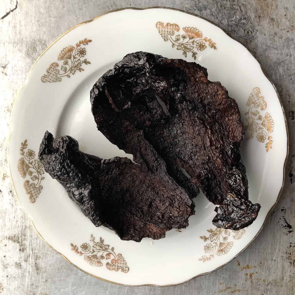 A crispy fried mulato chile ready to be broken over the bowls as garnish for tortilla soup.
